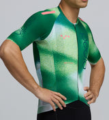 Close-up detail of the AeroPRISMA sleeve texture and mesh underarm panel on the Men's Pursuit 2.0 Cycling Jersey – AirFoils Green, illustrating breathable construction and aerodynamic finish.
