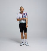 Front-facing view of a male cyclist wearing the Men's Pursuit 2.0 Cycling Jersey – AirFoils White, showcasing its aerodynamic cut, low-profile collar, and performance-focused fit.
