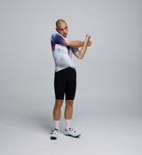 Side profile of the AirFoils White Men's Pursuit 2.0 Cycling Jersey, highlighting mesh underarm panels for ventilation, bonded sleeve finishes, and sleek aerodynamic shaping.