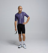 Front-facing image of a male cyclist wearing the Dusk Pursuit AIR Cycling Jersey, highlighting its streamlined cut, breathable performance fabrics, and modern dark dusk colourway.