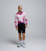 Front view of a male cyclist wearing the AirFoils Hot Pink Pursuit LS 2.0 Jersey, showcasing its sleek aerodynamic cut, bold colourway, and breathable high-stretch construction.