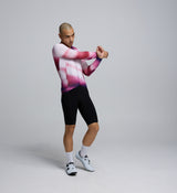 Side profile of the Men's Pursuit LS 2.0 Jersey – AirFoils Hot Pink, highlighting mesh underarm ventilation panels, bonded sleeve hems, and contoured fit for speed-focused riding.