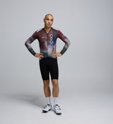 Front-facing image of a male cyclist wearing the Men's Pursuit 2.0 Long Sleeve Cycling Jersey – AirFoils Plum, highlighting its aerodynamic cut, sleek race fit, and breathable fabric.