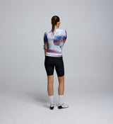Back view of the Women's Pursuit 2.0 Jersey in AirFoils White, featuring a lightweight rear pocket panel design, reflective accents, and secure triple storage layout.