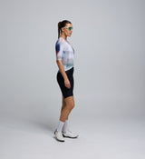 Side profile of the AirFoils White short sleeve jersey worn by a cyclist, showing the breathable mesh underarm paneling and clean heat-sealed sleeve finish for aerodynamic performance.