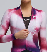 Zoomed-in detail of the bonded hem and AeroPRISMA sleeve on the AirFoils Hot Pink long sleeve jersey, illustrating the precision-engineered Italian fabrics and stitch-free aerodynamic finish.