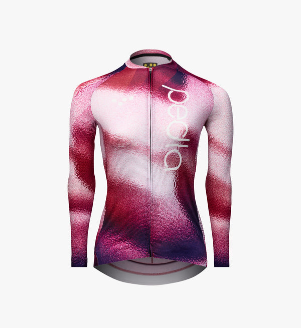 Isolated product image of the Pedla Women's Pursuit LS 2.0 Jersey in AirFoils Hot Pink, showcasing its aero race fit, bonded sleeve hems, and high-performance Italian fabrics.