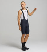 Front view of male cyclist wearing black SuperSYSTEM bib shorts – streamlined fit with high-density EIT chamois for all-day comfort