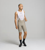 Front view of male cyclist wearing pumice SuperSYSTEM bib shorts – high-density EIT chamois and supportive fit for long-distance comfort
