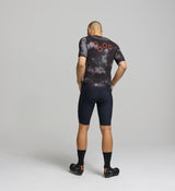 Back view of men’s SuperSYSTEM jersey – technical storage pockets and reflective details for visibility and function on the bike