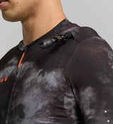 Close-up of hydration tube channel and seamless bonded hem – technical cycling jersey designed for efficiency and comfort in warm conditions