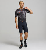 Front view of male cyclist wearing dark purple SuperSYSTEM jersey – bonded hem and breathable stretch fabric for performance comfort