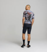 Back view of men’s SuperSYSTEM jersey – technical rear pockets and reflective accents for visibility and ride functionality