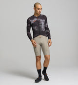 Front view of male cyclist wearing dark purple SuperSYSTEM jersey – breathable woven fabric and bonded hem for performance fit
