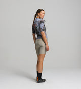 Side profile of women's light purple cycling jersey – ergonomic sleeve design and stretch fit for all-terrain riding