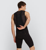 Back view of Pro Men's SuperFit Air Bib Shorts in Black on model, featuring a breathable perforated back panel and race-fit design for optimal airflow, comfort, and performance during high-intensity cycling.