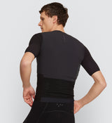 Back view of Pro Men's Velocity Cycling Jersey in Black on model, featuring a breathable mesh back panel, reinforced rear pockets, and elasticated openings for secure storage during road races and long-distance rides.