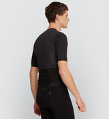 Side view of Pro Men's Velocity Cycling Jersey in Black on model, highlighting the aerodynamic sleeve channels, ergonomic fit, and lightweight fabric that reduce drag and optimise performance on long-distance road cycling.