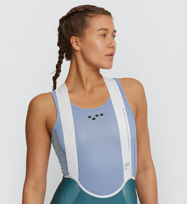 Front view of female cyclist wearing Galactic Lilac Air Base Layer – slim racer-back fit with flatlock seams for comfort