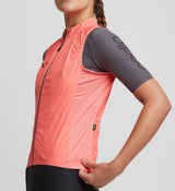 Pro Women's Pursuit Cycling Gilet - Coral: Weatherproof, AeroMESH panels, race-fit, reflective accents, 3x rear pockets.
